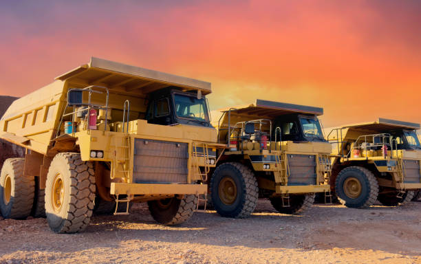 Mining truck in open-pit mining. Heavy machinery Construction equipment. Haul truck at construction site. Mining civil works, Earthmoving. Off highway Trucks on construction. Haul dump truck on sunset